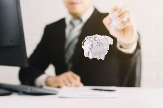 businessman emotions and fail concept crumpled paper on table with, unhappy no idea to thinking throwing papers in office