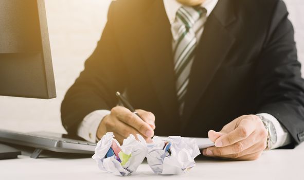 businessman emotions and fail concept crumpled paper on table with, unhappy no idea to thinking throwing papers in office