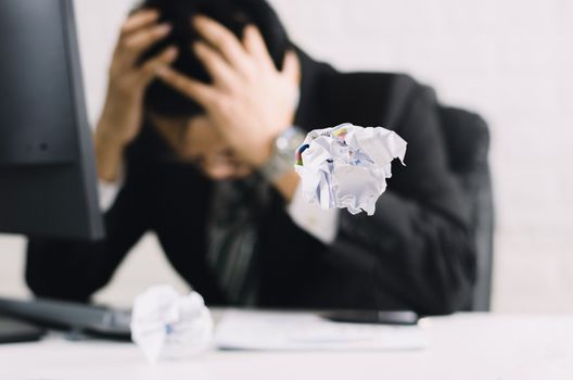 businessman emotions and fail concept crumpled paper on table with, unhappy no idea to thinking throwing papers in office