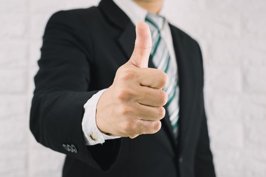 Business man thumbs up like Is excellent