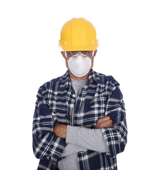 Construction Worker with arms folded wearing a hard hat, goggles, and dust mask, isolated over white.