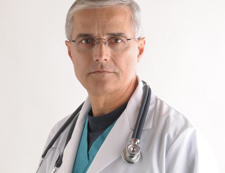 Serious Middle Aged  Doctor in Scrubs and Labcoat with Stethoscope closeup