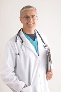 Smiling Middle Aged  Doctor in Scrubs and Labcoat with Stethoscope closeup