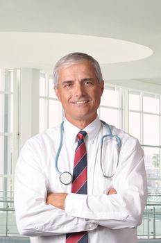 Portrait of a Middle Aged Male Doctor in Modern Medical Facility vertical