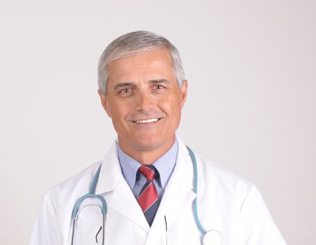 Portrait of a Middle Aged  Male Doctor in Lab Coat with Stethoscope