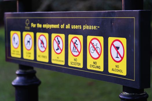 Public park rules sign in England