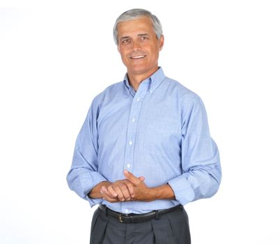 Businessman in Blue Shirt Smiling With Hands Clasped in front of Body isolated on white