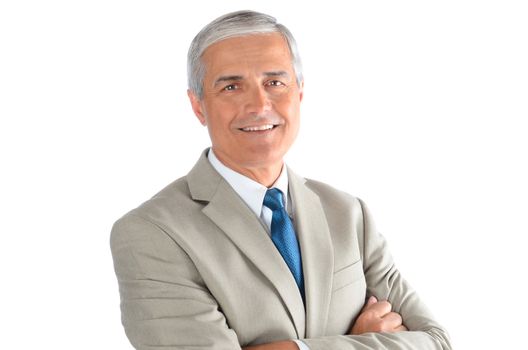 Portrait of a smiling middle aged businessman wearing a light tan suit with a blue necktie and his arms crossed. Horizontal over a white background.