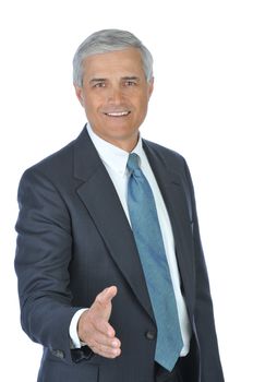 Businessman with hand extended to shake hands with you isolated over white