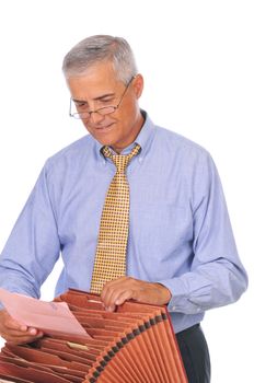 Smiling Businessman Putting Papers in File Box isolated on white