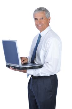 Smiling Middle Aged Businessman Holding an open Laptop Computer isolated on white.