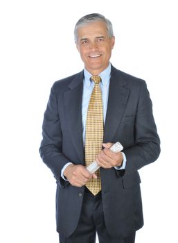 Smiling Middle Aged Businessman in dark suit standing and holding a rolled up newspaper isolated on white
