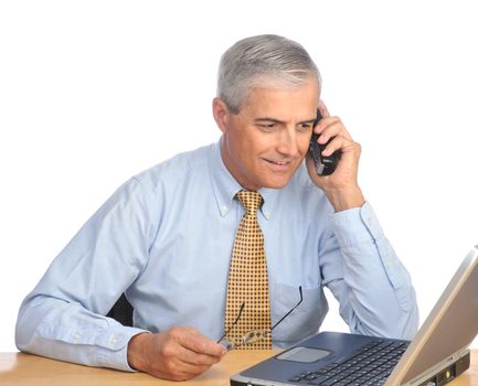 Businessman with laptop and phone