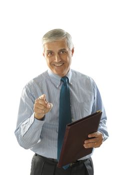 Middle Aged Businessman holding a leather folder smiling and pointing at camera vertical format torso only