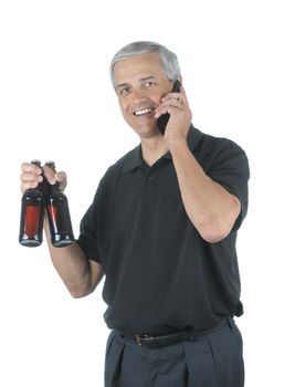 Middle Aged Businessman Talking on Cell Phone and holding two beers after a hard days work isolated over white