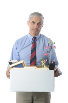 Downsized Middle Aged Businessman carrying a box of personal belongings isolated on white vertical format