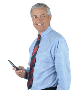 Smiling Middle aged businessman holding his cell phone isolated over white