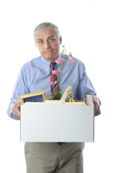 Downsized Middle Aged Businessman carrying a box of personal belongings isolated on white vertical format