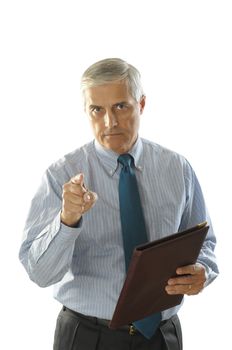 Middle Aged Businessman with a serious look holding a leather folder and pointing at camera vertical format torso only