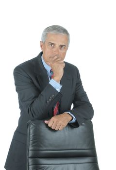 Serious Middle Aged Businessman leaning on chair back with hand on his chin isolated on white