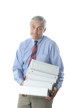 Overworked Businessman with frustrated expression Carrying a Large Stack of NoteBooks isolated over white vertical format torso only