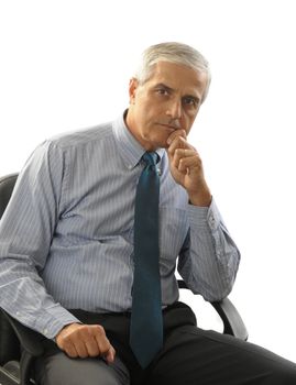 Serious Middle Aged Buisnessman in seated in his Office Chair one hand to chin isolated on white