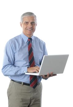 Middle Aged Businessman holding Laptop isolated over white vertical format torso only