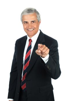 Portrait of a smiling middle aged business pointing at the viewer. Vertical format isolated on white.