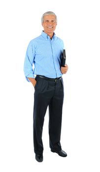 Middle aged businessman with one hand in pocket and a notebook under the other arm. Man is smiling and standing. Full length shot isolated over white