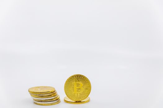 Stack of golden bitcoin tokens.Worldwide virtual internet cryptocurrency and digital payment system.Digital coin money crypto currency on bitcoin farm in digital cyberspace. Copy space.Negative space.