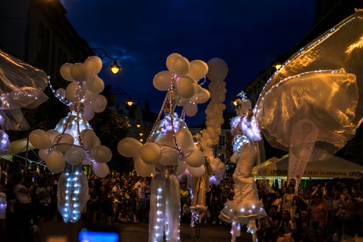 Sibiu City, Romania - 20 June 2019. Mademoiselle Paillette perform White World show in night at the Sibiu International Theatre Festival from Sibiu, Romania.