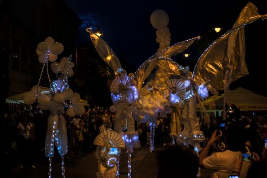 Sibiu City, Romania - 20 June 2019. Mademoiselle Paillette perform White World show in night at the Sibiu International Theatre Festival from Sibiu, Romania.
