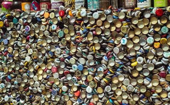 Malaga, Spain - August 11, 2018. Old Beer bottle and caps, a mix of various european brands.