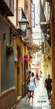 Malaga, Spain - August 06, 2018. Old street around the historic center with tourist, Malaga city, Spain