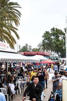 Malaga, Spain - April 21, 2018. People at the restaurant on the promenade, Malaga city, Spain