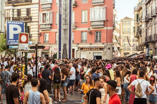 Malaga, Spain - August 13, 2018. People having fun on the street at the Feria de Malaga, an annual event that takes place in mid-August and is one of the largest fiestas in Spain