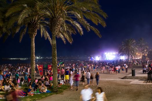 Malaga, Spain - June 23, 2018. People on the Malagueta beach on night of San Juan