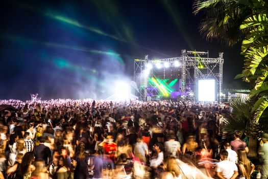 Malaga, Spain - June 24, 2018. Young people celebrate the Night of San Juan with music and dance on the Malagueta beach, Malaga city, Spain