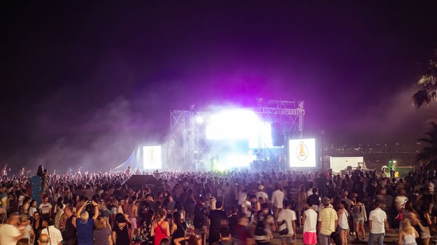 Malaga, Spain - June 23, 2018. People on the Malagueta beach on night of San Juan