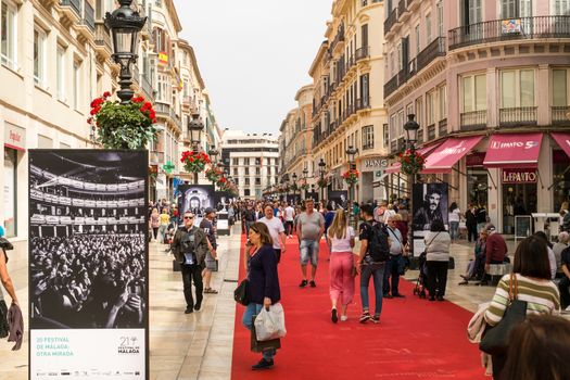 Malaga, Spain - April 21, 2018. People on the red carpet at the Marques de Larios street from anual film festival Cine en Espanol, Malaga, Spain
