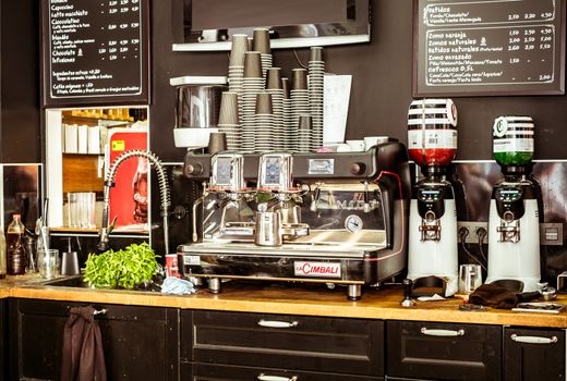 Powerful automatic espresso and cappuccino machine inside a bar in old town city Malaga, Spain