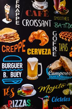 Malaga, Spain - August 06, 2018. Restaurant menu chalkboard on the Spanish street of Malaga city, Spain