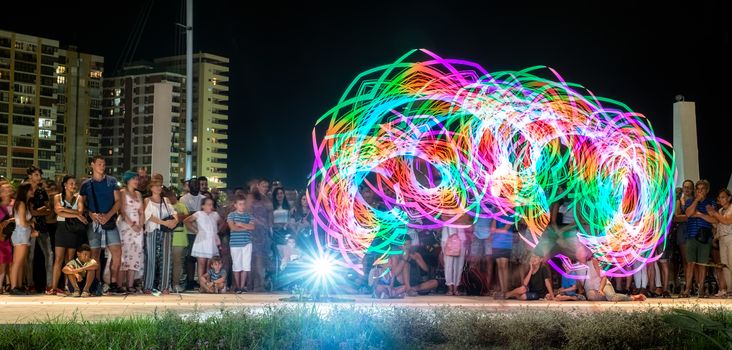 Malaga, Spain - August 10, 2018. street light painting show at the ceremonial opening of the city celebrations, announce the beggining of the annual week 'Feria de Malaga, Costa del sol, Spain