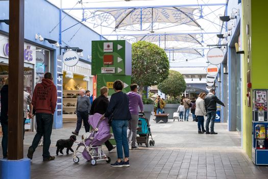 Malaga, Spain - April 07, 2018. shopping people at the Plaza Mayor mall Malaga, Spain