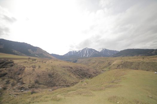 Beautiful mountain landscape. Wildlife Kyrgyzstan. Clouds in the sky. Kyrgyzstan. High quality photo