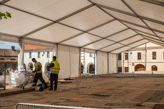 Sibiu, Romania - April 26, 2019  Workers at preparations for Informal meeting of heads of state or government 2019 in Small Square  Sibiu, Romania