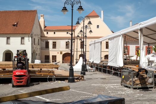 Sibiu, Romania - April 26, 2019  Workers at preparations for Informal meeting of heads of state or government 2019 in Small Square  Sibiu, Romania