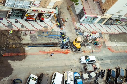 Malaga, Spain - August 13, 2018. workers change the city water network pipes
