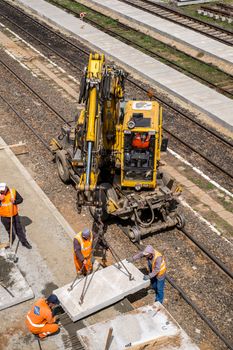 Sibiu, Romania - April 20, 2019. Workers working at Central Railway station in Renovation and modernization, reconstruction of platforms between the lines