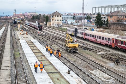 Sibiu, Romania - March 16, 2019. Workers working at Central Railway station in Renovation and modernization, reconstruction of platforms between the lines